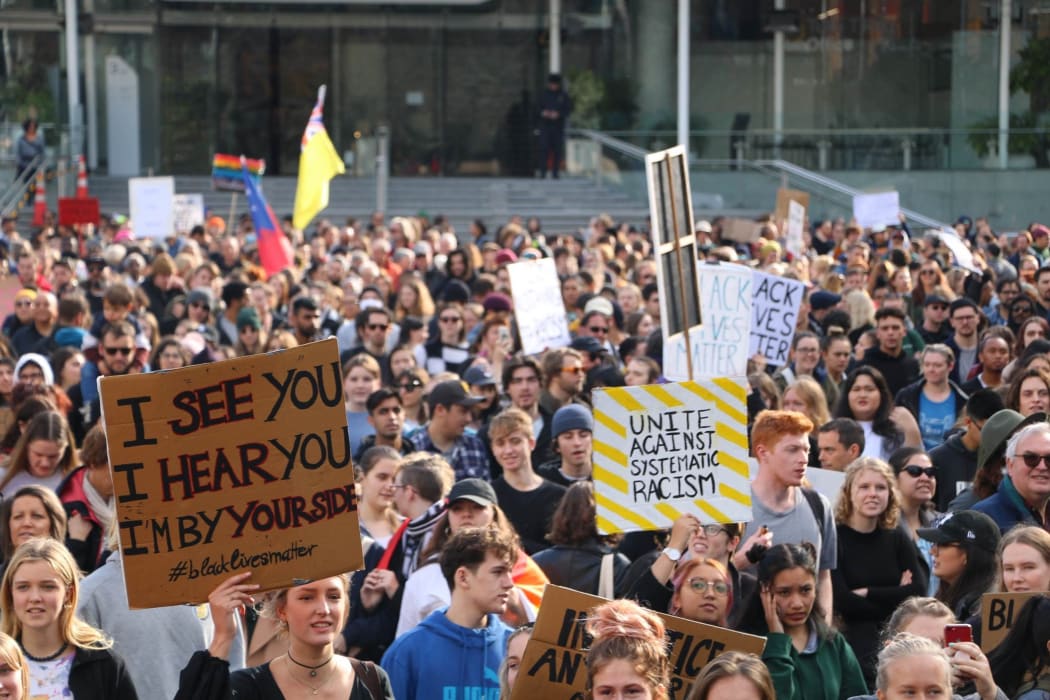 Protesters hold up their signs in Aotea Square, Auckland at the Black Lives Matter rally on 14 June, 2020.