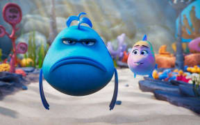 A still from the animation film Pout-Pout Fish showing grumpy Mr Fish swimming beside a smaller fish.