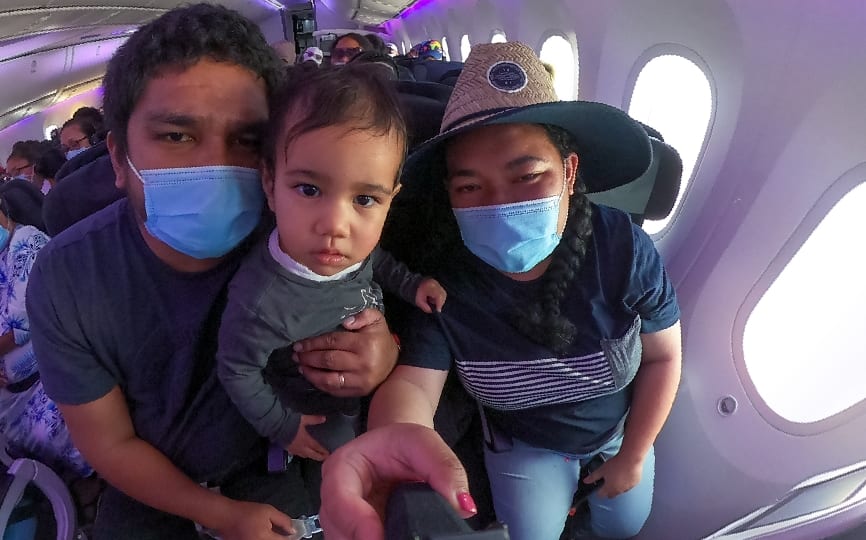 Elena and her family on the flight to Samoa