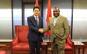 Papua New Guinea's prime minister James Marape (right) meeting with China's Ambassador, Xue Bing, in Port Moresby. 6 August, 2019