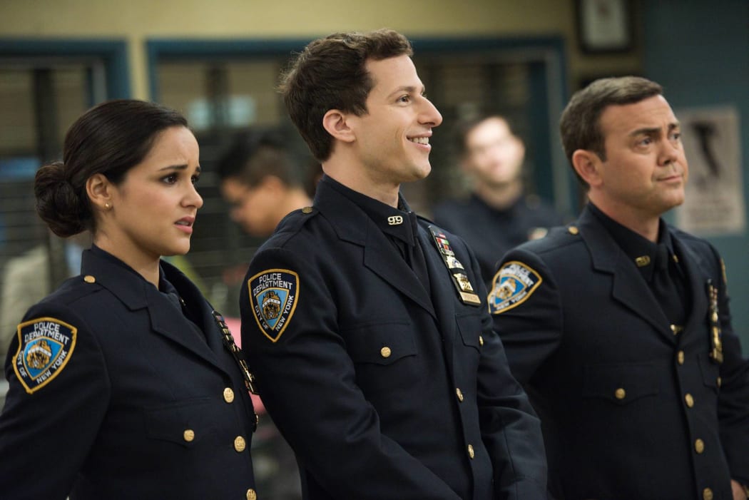 (Amy (Melissa Fumero), Jake (Andy Samberg) and Charles (Joe Lo Truglio) in the Season 5 episode of Brooklyn Nine-Nine, "The Funeral".
