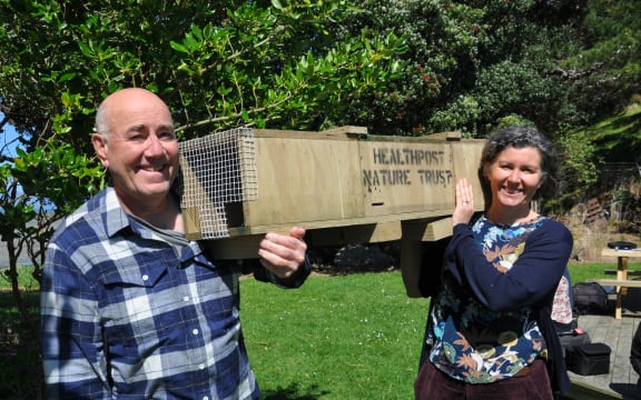 HealthPost Nature Trust chair Peter Butler and Onetahua Restoration project spokesperson Sky Davies with a trap.