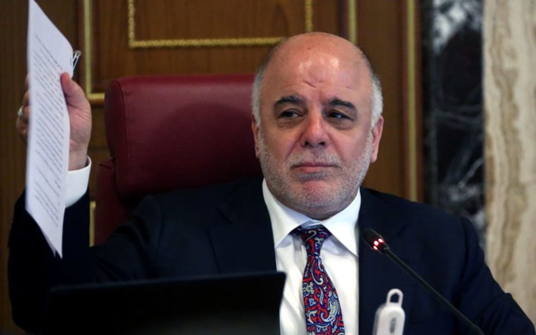 August 9, 2015 Iraqi Prime Minister Haider al-Abadi gesturing during an extraordinary meeting in the Iraqi capital, Baghdad AFP PHOTO / HO / IRAQI PRIME MINISTER'S OFFICE === RESTRICTED TO EDITORIAL USE - MANDATORY