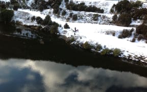 The two families were picked up by helicopter after they used an emergency phone in the area.