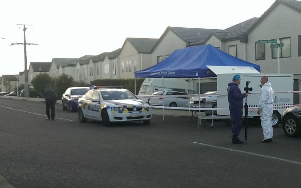 Police cordon off a house in the west Auckland suburb of Ranui where two bodies have been found.