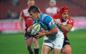Kyle Brink of Lions challenges Matt McGahan of Blues during the Super Rugby match between Lions and Blues on 14 May 2016 at Ellis Park Stadium.