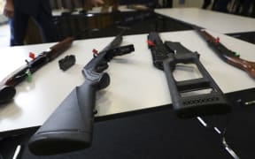 A selection of firearms which are now prohibited, on display to media at a police press conference
