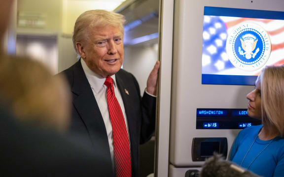US President Donald Trump speaks to members of the press aboard Air Force One as he heads to Joint Base Andrews in Maryland after departing West Palm Beach, Florida on November 2, 2025. Trump is returning to the White House from his Mar-a-Lago, Florida, residence where he spent the weekend. (Photo by ROBERTO SCHMIDT / AFP)