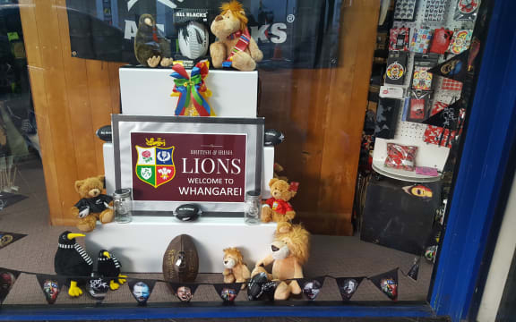 Whangārei puts out the welcome mat for the Lions: display in Rathbone Gifts window.
