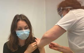 A woman gets her Covid-19 vaccination in London, Britain, in this file photo. The protection that vaccines give against coronavirus infection,
