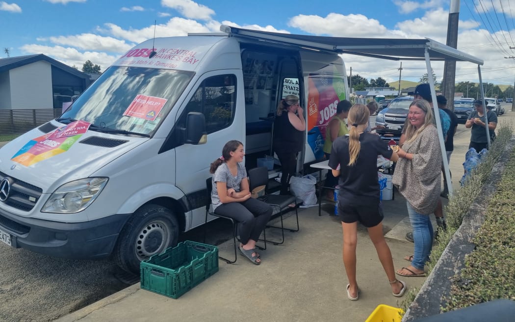 In Waipawa, volunteers dropped in for a sausage, baking, and a bottle of water before they headed off to the next job.