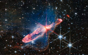NASA’s James Webb Space Telescope captures a tightly bound pair of actively forming stars, known as Herbig-Haro 46/47, in high-resolution near-infrared light.