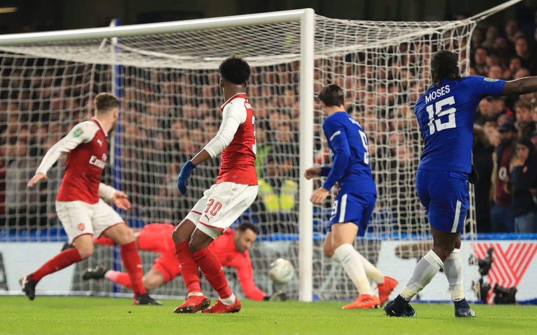 Chelsea's Victor Moses has his shot saved on the line by Arsenal goalkeeper David Ospina.