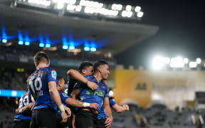 The Blues celebrate with Rieko Ioane during the Blues v Waratahs, Super Rugby Pacific match, Eden Park, Auckland.