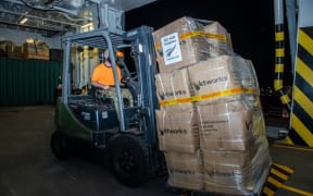 Supplies are loaded onboard the HMNZS Canterbury for Tonga's relief effort.