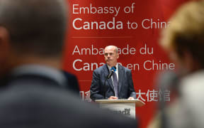 Deputy chief of Mission of Canadian embassy Jim Nickel speaks to journalists and diplomats at the Canadian embassy in Beijing on August 11, 2021