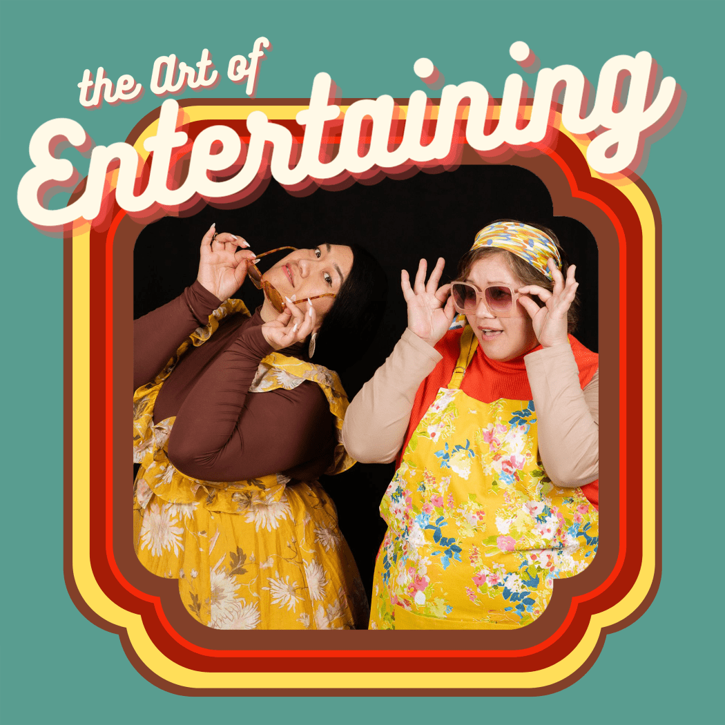 Two young women in1970s clothing pose inside a brown, red and yellow frame against a light green backdrop. Above their heads is the cation 'The Art of Entertaining'.