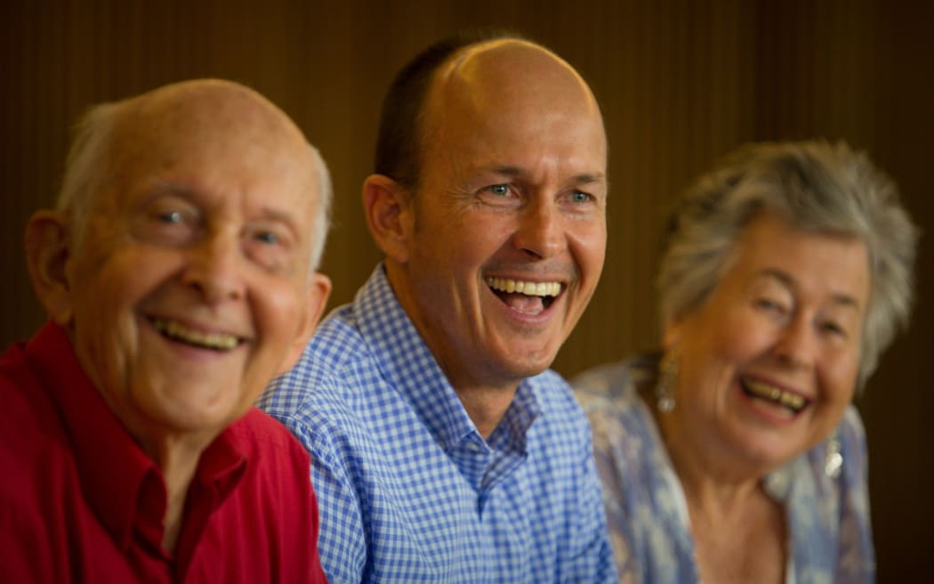 Australian journalist Peter Greste's father Juris Greste, left, brother Andrew Greste and mother Lois Greste celebrate his release.