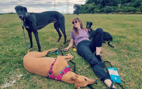 Greyhounds As Pets events and volunteer coordinator Dawn Glover with her greyhound pals.
