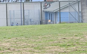 Youths on roof Korowai Manaaki