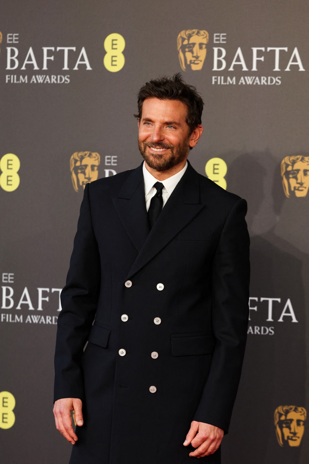 US actor and film director Bradley Cooper poses on the red carpet upon arrival at the BAFTA British Academy Film Awards at the Royal Festival Hall, Southbank Centre, in London, on February 18, 2024. (Photo by Adrian DENNIS / AFP)