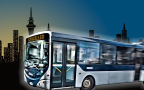 Bus against Auckland skyline