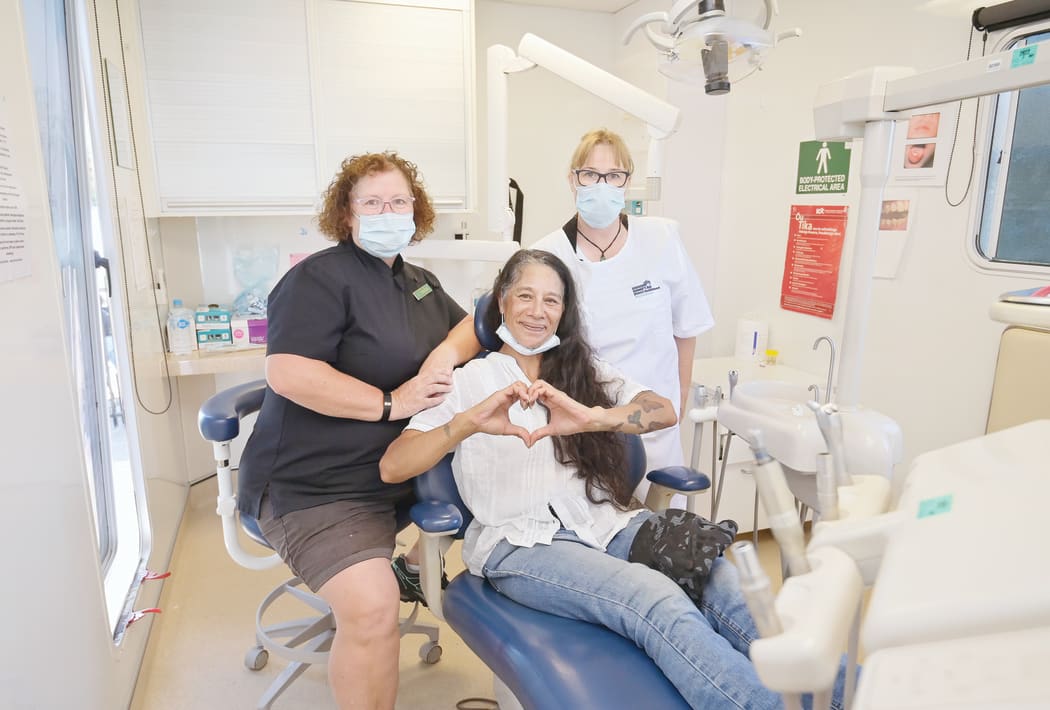 Sophie O'Neill received treatment on Tuesday from dentist June Fraser and dental assistant Lerlene Wright.