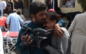 A man cries after blast in front of a hospital in Quetta, Pakistan