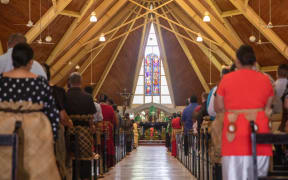 Tongan's gather at St Mary's Cathedral in Nukualofa to commemorate the one year anniversary of the eruption and tsunami.