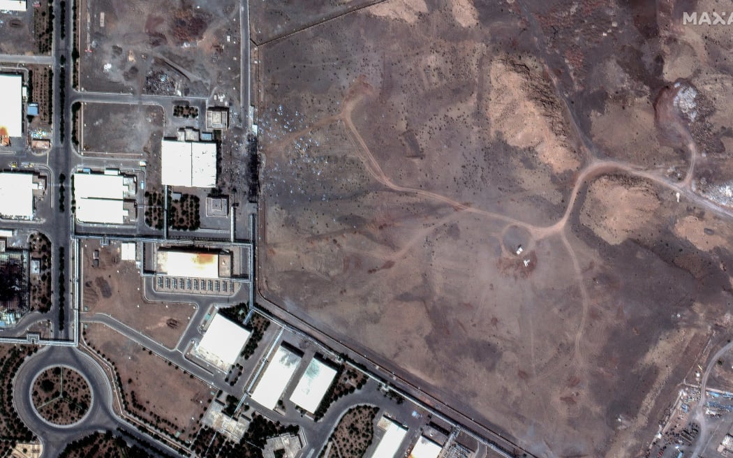 Satellite imagery shows airstrike craters over underground centrifuge halls filled and covered with dirt in Natanz nuclear enrichment facility in central Iran.