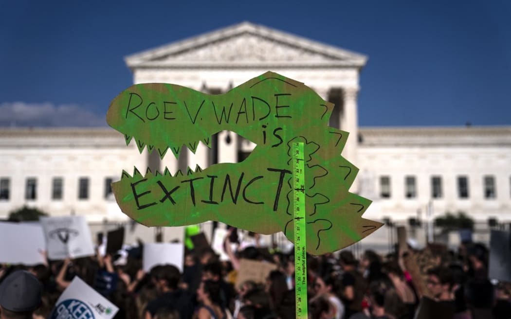 WASHINGTON, DC - JUNE 24: An anti-abortion sign is seen in front of the U.S. Supreme Court after the Court announced a ruling in the Dobbs v Jackson Women's Health Organization case on June 24, 2022 in Washington, DC. The Court's decision in the Dobbs v Jackson Women's Health case overturns the landmark 50-year-old Roe v Wade case, removing a federal right to an abortion.   Nathan Howard/Getty Images/AFP (Photo by Nathan Howard / GETTY IMAGES NORTH AMERICA / Getty Images via AFP)