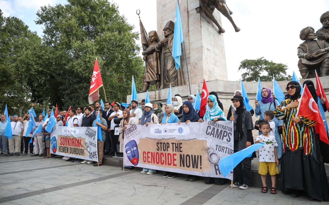 People hold a protest in Istanbul as part of the worldwide "Stop Genocide Now" campaign to draw attention to China's policies towards the Xinjiang Uyghur Autonomous Region, on 31 July, 2022.