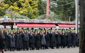 Tangata whenua welcoming visitors onto Tuurangawaewae Marae.
