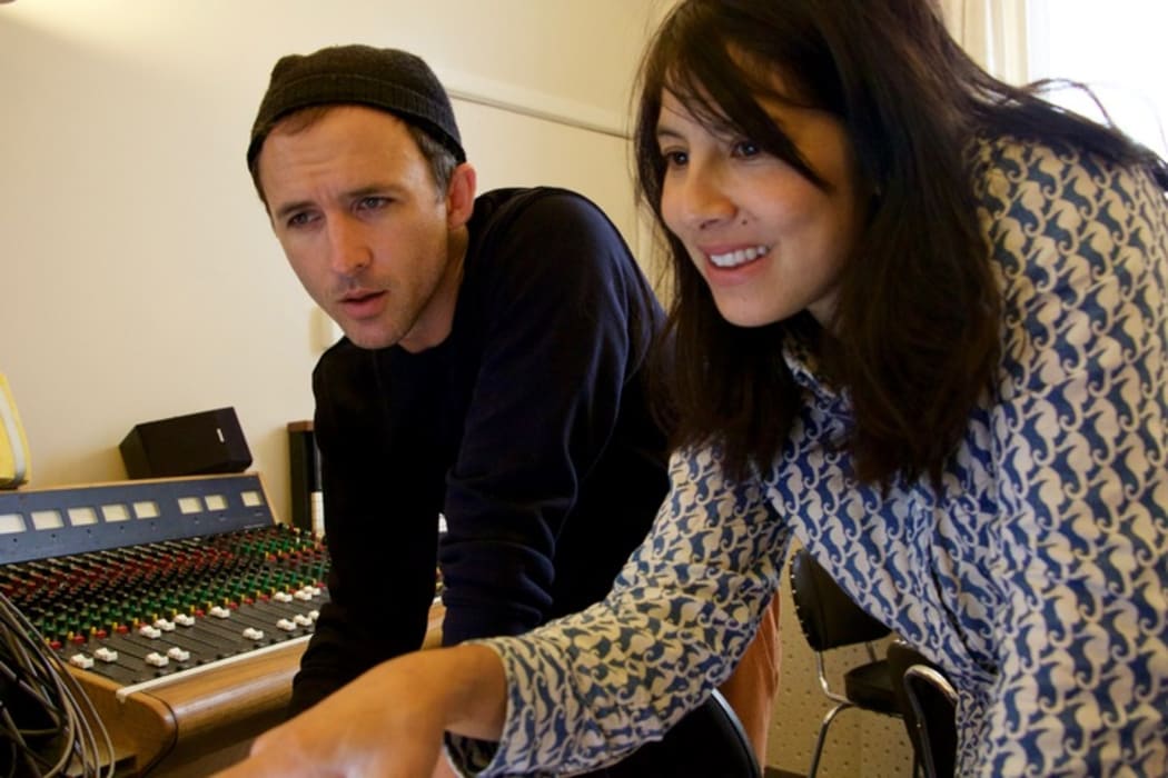 Lord Echo, aka Mike Fabulous, and Yadana Saw listen to the album Harmonies.