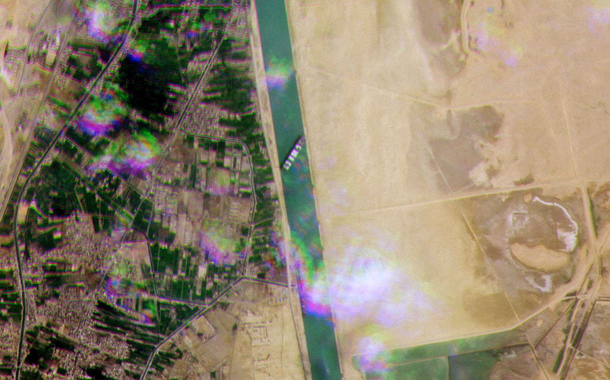 A satellite image by Planet Labs Inc shows the Taiwain-owned ship 'Ever Given', operated by the shipping company Evergreen, lodged sideway sacross Egypt's Suez Canal.