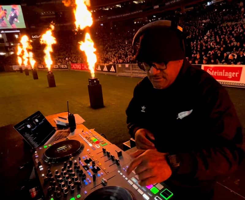 DJ Al’Goodie behind decks at an All Blacks game in July 2024.