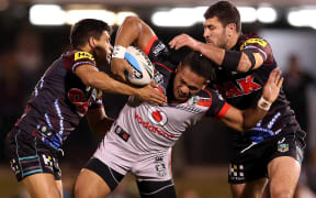Tyrone Peachey (L) and  Sam McKendry (R) tackle Solomone Kata