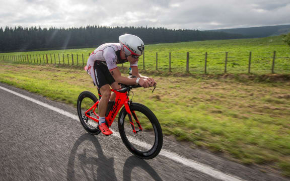 Dylan McNeice on the bike leg at Ironman New Zealand in 2016.