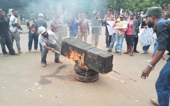 Student protesters burning a coffin in Jakarta on 18 January, 2019.
