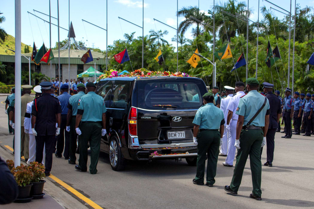 Military officers escort the hearse carrying the coffin of the former Papua New Guinea's prime minister Michael Somare during his funeral ceremony at Parliament House in Port Moresby.