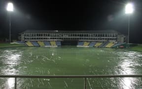 The tarp-covered ground is seen following rain, Pallekele, Sri Lanka.