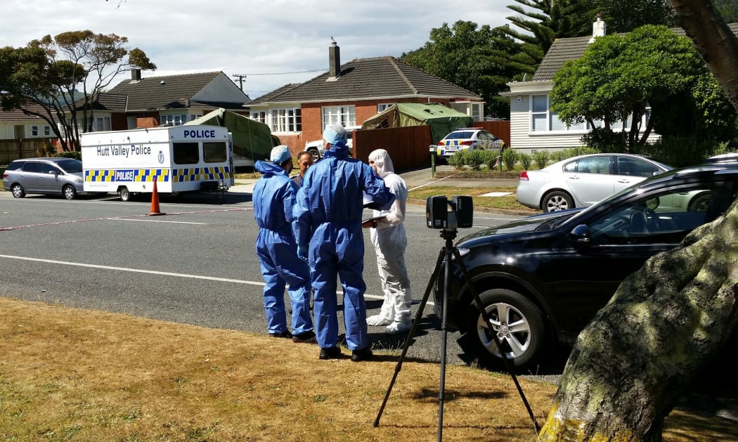 Police and forensic investigators at the scene in Taita on Friday.