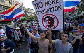 A rally in Bangkok a day after a bomb attack that killed one and left dozens injured.