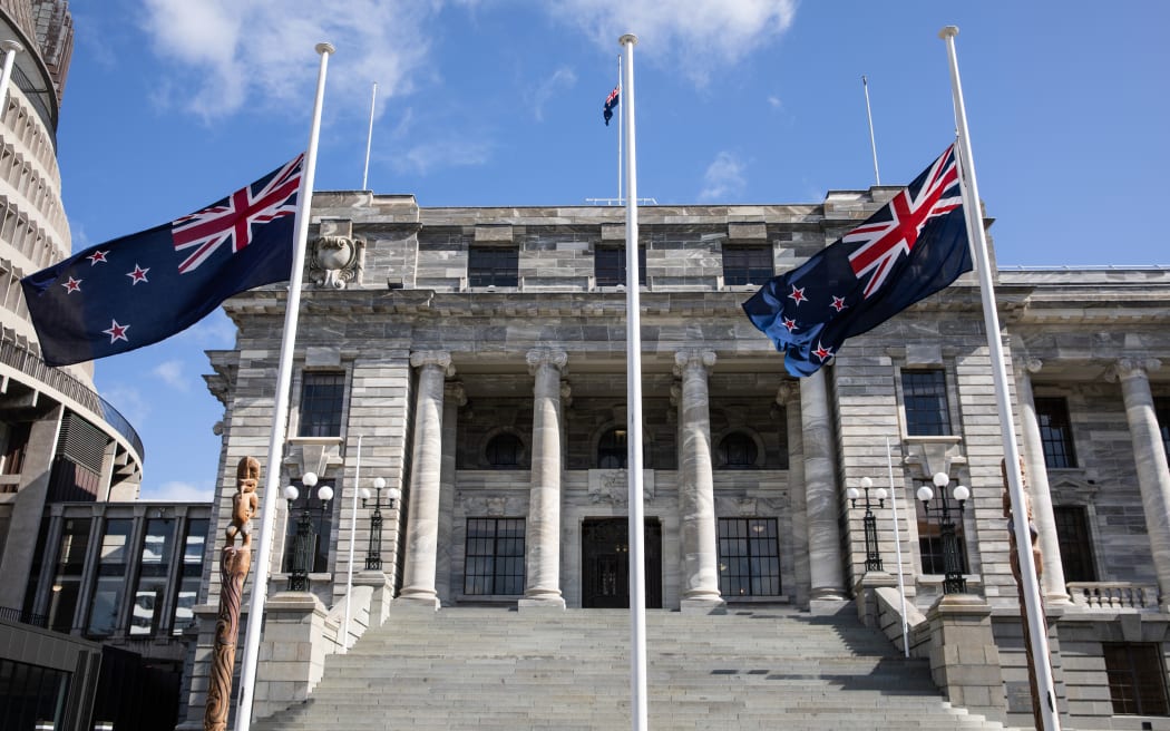 Flags at half mast in front of Parliament