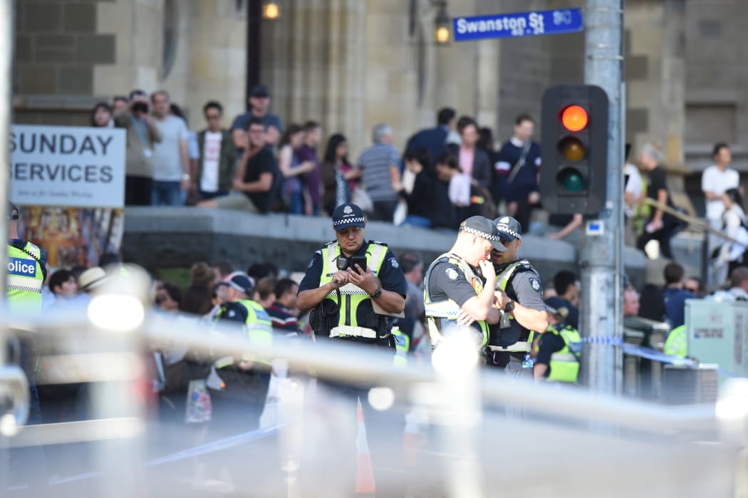 Police and emergency personnel work at the scene