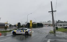 Porana Road closed at Wairau Road end due to flooding in Auckland on 9 May 2023.