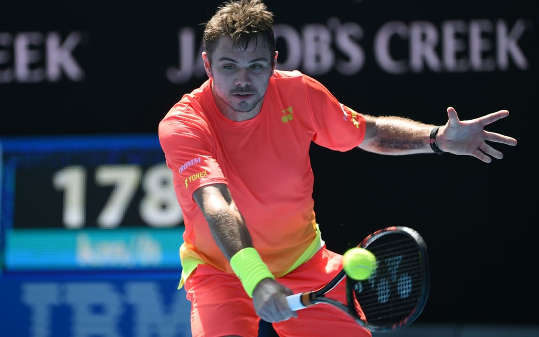 Switzerland's Stan Wawrinka in action against Czech Republic's Lukas Rosol on day six of the 2016 Australian Open, January 23, 2016. AFP PHOTO / WILLIAM WEST