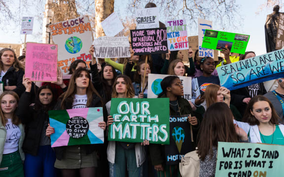 Thousands of young people gather in Parliament Square in central London to protest against the governments lack of action on climate change.