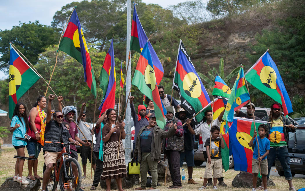 Local residents attend a campaign meeting of the Front de Liberation Nationale Kanak et Socialiste (FLNKS) poses for a photograph at the Riviere Salee district during a campaign meeting in Noumea, in the French Pacific territory of New Caledonia, on July 3, 2024. French people go to polls on July 7, 2024 for the decisive final round of the snap election France's President called after his camp received a drubbing in European elections last month. (Photo by Delphine MAYEUR / AFP)