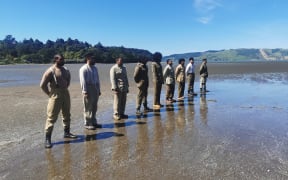 Soldiers stand at attention (dramatic re-enactment).